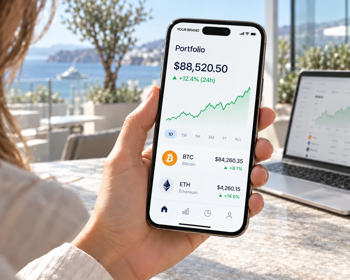 Close-up of a smartphone showing YOUR BRAND in the carrier field and a crypto portfolio